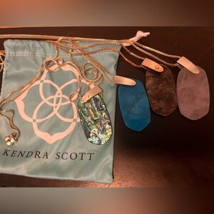 Bundle of 4 Kendra Scott Long Pendant Necklaces 
with one jewelry bag